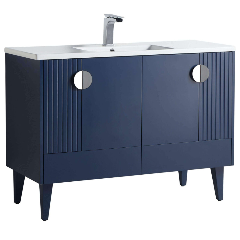 The Venezian 48 inch Bathroom Vanity showcases a modern navy blue finish, two cabinet doors with vertical grooves, round silver handles, angled legs, a white countertop, integrated sink, and a chrome faucet.