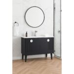 The Venezian 48 inch Bathroom Vanity with a black cabinet, white countertop, and chrome faucet sits below a round mirror on a white marble wall. A towel ring with a white towel and glass shower enclosure are also visible.