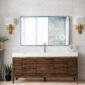 Modern bathroom with a Linear 72 inch Single Bathroom Vanity Cabinet, rectangular mirror, white sink, gold wall sconces, white brick walls, and potted plants on the floor and a small table.