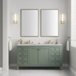 A modern bathroom features a chic Chicago 60 inch Double Bathroom Vanity Cabinet in green with gold fixtures. Two large rectangular mirrors hang above, and natural light filters through horizontal blinds on the window, creating an inviting and airy ambiance.