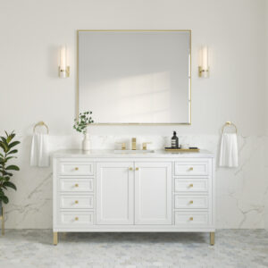 A minimalist bathroom features the Chicago 60 inch Single Bathroom Vanity Cabinet with gold handles, a rectangular mirror, and two wall sconces. A small plant and toiletries decorate the countertop, while marble tiles cover the lower walls and floor for an elegant touch.
