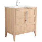 The Leafside 30 Inch Vanity flaunts a light wood finish, paneled doors, and metal handles. It includes a white countertop and modern faucet, ideal for elevating any bathroom style.