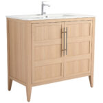 The Leafside 36 Inch Bathroom Vanity With Sink features a light oak finish, paneled doors with sleek metal handles, and a white rectangular sink paired with a modern chrome faucet, seamlessly blending functionality and style.