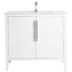 The Leafside 36 Inch Bathroom Vanity With Sink features two paneled cabinet doors, each adorned with a vertical metal handle, topped with a modern metallic faucet. Its sleek, minimalist design makes it an elegant choice for any bathroom.