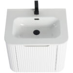 The Caskvalley 24 Inch Wall Mounted Bathroom Vanity features a ribbed cabinet with a white rectangular basin, a sleek black faucet, central drain, and overflow hole, offering a modern design that contrasts beautifully with the smooth sink surface.