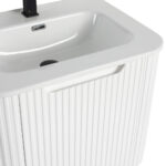 The Caskvalley 24 Wall Mounted Bathroom Vanity With Sink boasts a modern style with its white rectangular basin, ribbed cabinet front, and black faucet. It includes a small overflow hole and integrated handle for added convenience.