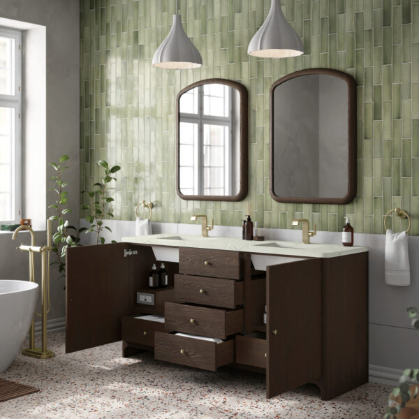 A modern bathroom showcases a Gracyn 72 inch Double Bathroom Vanity in dark wood, with two mirrors and brass fixtures. Green textured tiles and terrazzo flooring add charm. Open cabinet shelving is exposed beneath pendant lights, while a bathtub and potted plants enhance the space on the left.