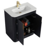 The Shireplace 30 Inch Bathroom Vanity With Sink offers a stylish white basin and gold faucet. Inside its black cabinet, youll find towels in gray, red, and teal, as well as toiletries and a decorative basket on the shelves.