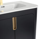 The Shireplace 30 Inch Bathroom Vanity features a white sink on a dark, curved cabinet with a gold vertical handle for elegance and a partially visible shiny faucet above.