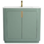 The Shireplace 36 Inch Bathroom Vanity With Sink offers a modern touch with a smooth light green finish, brass accents, and a white countertop. It includes a single brass faucet and two cabinet doors for storage, maintaining a sleek, minimalistic design.