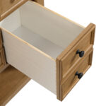 Open the wooden drawer with black knobs from the Malibu 36-inch Bathroom Vanity Cabinet in Amber Birch, revealing a smooth, light-colored lined interior.