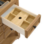 Open wooden drawer with a natural finish and organized compartments, featuring a circular opening. Part of the Malibu 48 inch Bathroom Vanity Cabinet in Amber Birch, it includes visible black knobs for sleekness.