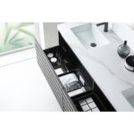 The Matera 72 Inch Wall Mount Double Bathroom Vanity With Countertop showcases a sleek white surface, double rectangular sinks, and open storage for towels and toiletries, complemented by a bright space with greenery in the background.