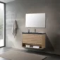 A modern minimalist bathroom featuring the Matera 36 Inch Wall Mount Bathroom Vanity With Countertop, a rectangular mirror, concrete wall, towel racks, potted plant, large window with outdoor view, and a beige textured rug.