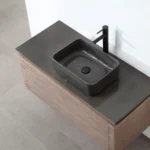 Overhead view of the Ocala 48 Inch Wall Mount Bathroom Vanity With Vessel Sink, showcasing a dark vessel sink, black faucet, and wood-textured cabinet set on a light gray tiled floor with a white wall background.