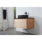 A modern bathroom featuring the Ocala 36 Inch Wall Mount Bathroom Vanity With Vessel Sink, complete with a black countertop, rectangular black sink, and black faucet. A towel ladder and part of a bathtub are seen in the background.