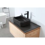 A modern bathroom with the Ocala 36 Inch Wall Mount Bathroom Vanity With Vessel Sink, black faucet, and soap dispenser on a sleek black countertop. Gray tile floor and white walls enhance the clean, contemporary style.