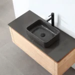The Ocala 48 Inch Wall Mount Bathroom Vanity With Vessel Sink boasts a modern black rectangular vessel, matte black faucet, and light wood cabinet, perfect for contemporary bathrooms.