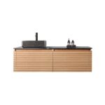 The Ocala 60 Inch Wall Mount Bathroom Vanity With Vessel Sink offers a modern floating design with a ribbed wood front, black countertop, rectangular vessel sink, matte black faucet, and includes two dark bottles on a tray.