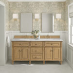 A bathroom featuring a Lorelai 72 inch Double Bathroom Vanity with two sinks, matching mirrors, wall sconces, floral wallpaper, light hexagonal floor tiles, a vase of flowers on the counter, and a towel hanging on the left wall.