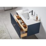 The Barcelona 42 Inch Wall Mount Bathroom Vanity features a white marble countertop, integrated sink, matte black faucet, and navy blue cabinet. Open drawers reveal organized essentials like towels and toiletries.
