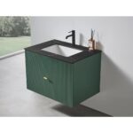 The Barcelona 30 Inch Wall Mount Bathroom Vanity showcases a dark green ribbed front, black integrated sink and countertop, matte black faucet, and gold handle. A diffuser rests atop the vanity, while a window provides a view of greenery.