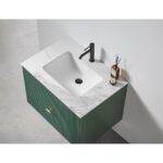 The Barcelona 30 Inch Wall Mount Bathroom Vanity offers a white marble countertop, integrated rectangular sink, black faucet, and green cabinet with vertical grooves. A small tray with a diffuser and bottle is placed on the right side.