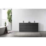 Minimalist bathroom featuring a Rothenburg 72 Inch Freestanding Bathroom Vanity, small bottles on the counter, a freestanding tub, beige rug, and a wall of green plants by a bright window.