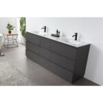 Modern bathroom featuring a Rothenburg 72 Inch Freestanding Vanity with double sinks, black faucets, six drawers, gray tile floor, a small table with a plant, hanging plant on a white wall, and a beige rug partially visible on the left.