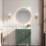 A stylish bathroom features the Aveline 30 Inch Freestanding Bathroom Vanity With Top, a round backlit mirror, gold fixtures, wall sconces, a black-and-white checkered floor, and a large window with brown curtains streaming in natural light.