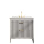 The Aveline 36 Inch Freestanding Bathroom Vanity With Top features a ribbed gray finish, two drawers with gold handles, a white countertop, and elegant gold faucet fixtures for a modern touch.