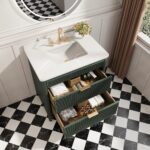 The Aveline 36 Inch Freestanding Bathroom Vanity With Top features a white sink, gold faucet, and three open drawers for storage. Set on a checkered floor, it includes a round mirror and a vase of flowers for added elegance.