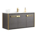 The Oakville 48 inch Modern Bathroom Vanity features a dark wood finish with gold trim, a white countertop, gold hardware and faucet, two clear glasses, and a soap dispenser for an elegant touch.