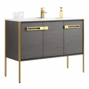 The Oakville 48 inch Modern Bathroom Vanity features dark wood cabinets, gold handles and legs, a white countertop with built-in sink, gold faucet, two clear glasses, and a soap dispenser—ideal for modern bathroom updates.