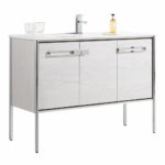 The Oakville 48 inch Modern Bathroom Vanity features a white finish, rectangular sink, chrome faucet, soap dispenser, two glasses, three cabinet doors, and stands on four slim metal legs for a sleek look.