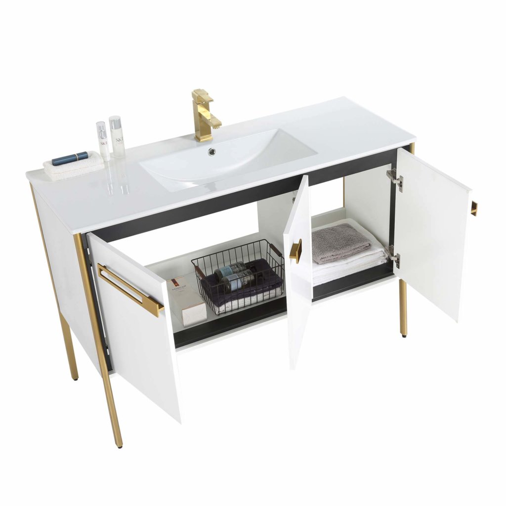 The Oakville 48 inch Modern Bathroom Vanity showcases a modern white design with gold accents, built-in sink, open cabinet doors revealing shelves for towels and toiletries, and a sleek gold faucet.