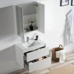 A modern bathroom features a Valencia 30 inch Wall Mount Vanity With Sink with two open drawers, a mirrored medicine cabinet displaying toiletries, a robe hanging on the wall, and a wicker laundry basket with towels on the floor.