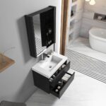The Valencia 30 inch Wall Mount Vanity With Sink has a white rectangular basin, dark wood cabinet, two open drawers with toiletries, and a mirrored medicine cabinet above. Marble floors and a bathtub complete the stylish bathroom setting.