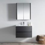 A modern bathroom features the Valencia 30 inch Wall Mount Vanity With Sink, topped with a white countertop and rectangular sink. Above is a wall-mounted mirrored cabinet, with a woven Home basket on the floor to the right.
