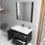 A modern bathroom showcases the Valencia 36 inch Wall Mount Vanity With Sink in a dark wood finish, open drawers, and side cabinet. Above the sink is a square mirror; to the left are a gray chair and floating shelf, with a wooden door frame on the right.