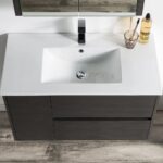 A modern bathroom with the Valencia 36 inch Wall Mount Vanity With Sink, featuring a rectangular white basin, dark wood vanity, silver faucet, and accessories on the right. The floor showcases gray wood-patterned tiles.