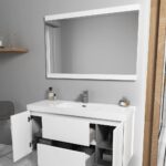 A modern bathroom showcases the Valencia 48 inch Wall Mount Vanity With Sink, open drawers and cabinets displaying smart storage. The vanity’s countertop is organized with toiletries, set against gray walls and a marble floor for a sleek look.