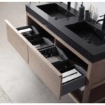 Two wooden vanity drawers are open beneath the Bibury 48 Inch Double Bathroom Vanity with Top, showing organized compartments with bathroom items like bottles, towels, and boxes. Modern fixtures and a tiled floor can be seen.