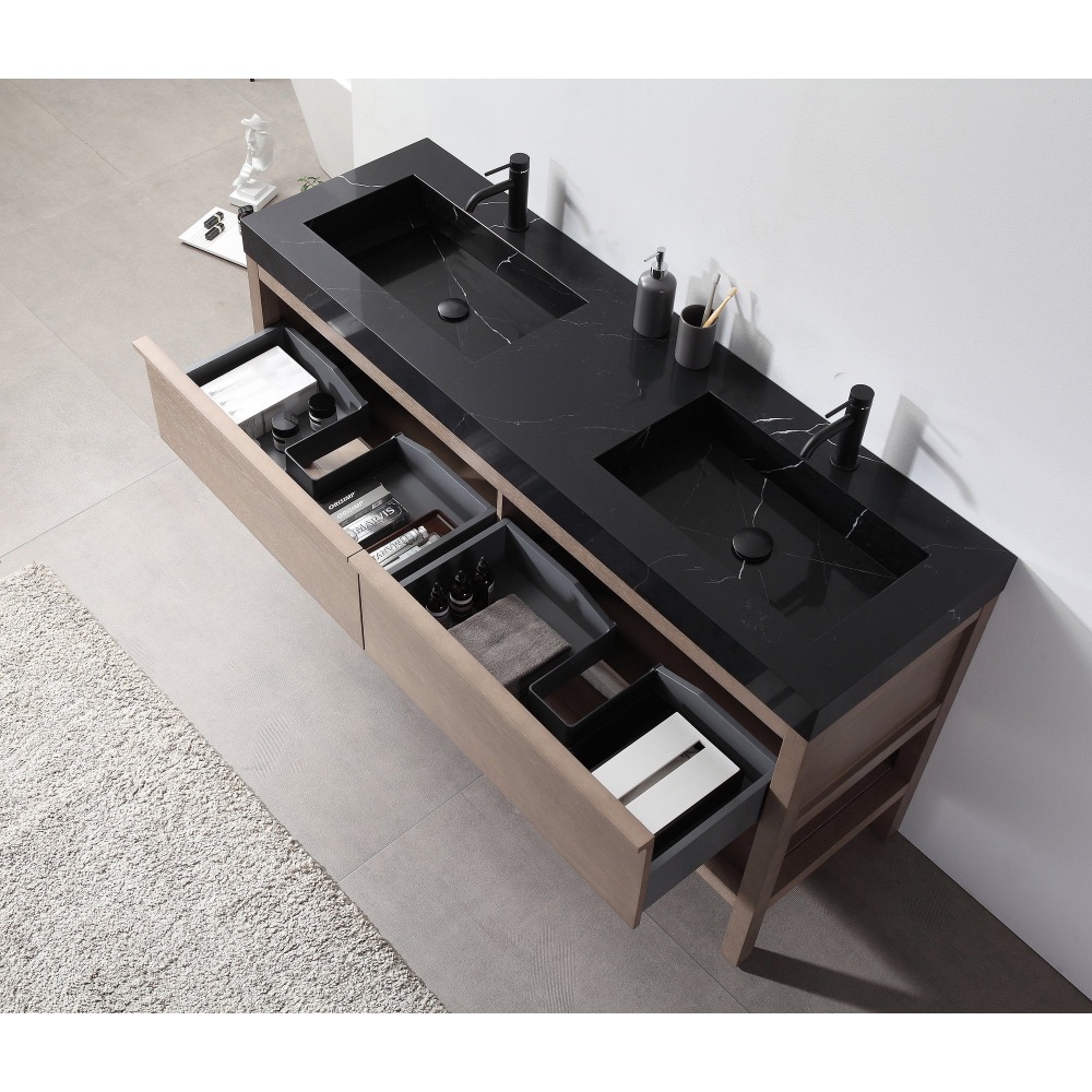 The Bibury 72 Inch Double Bathroom Vanity with Top features a modern black double sink, matte black faucets, and open wooden drawers organized with toiletries, towels, and boxes. A stylish tiled floor showcases a partially visible rug.