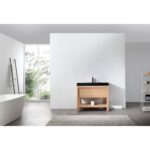 A modern minimalist bathroom features a freestanding bathtub, ladder towel rack, Bibury 36 Inch Bathroom Vanity with Top, open shelving with toiletries, a gray rug, and large windows letting in natural light.