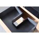 The Bibury 36 Inch Bathroom Vanity with Top includes an open wooden drawer featuring a dark gray plastic organizer with a U-shaped cutout to neatly fit around sink plumbing.