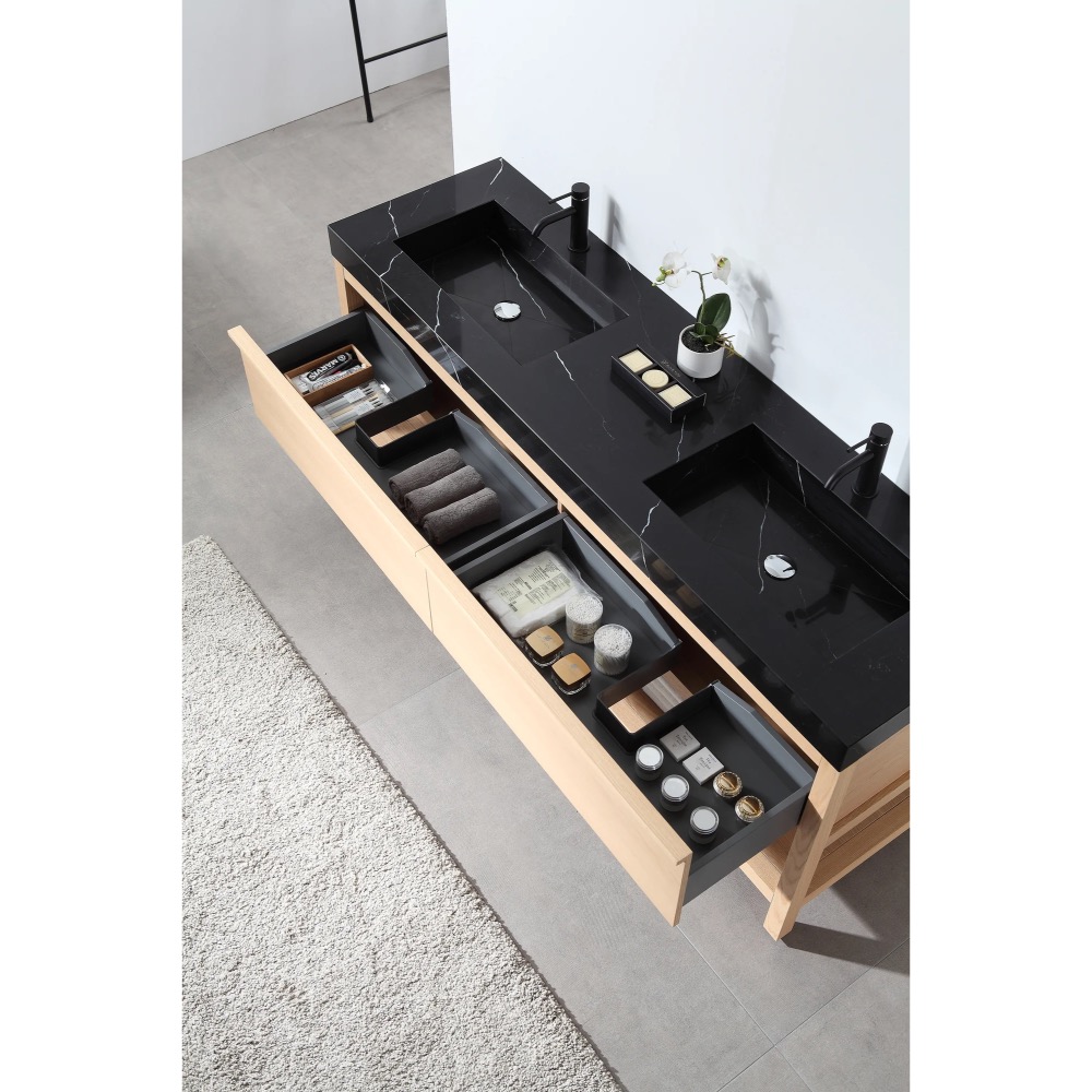 The Bibury 72 Inch Double Bathroom Vanity with Top includes two black sinks, organized wooden drawers for towels and toiletries, a light rug beside it, and a small potted plant on the counter.