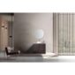 Minimalist bathroom featuring the Celle 36 Inch Bathroom Vanity With Vessel Sink topped with a round mirror, a modern chair on the left, and a large window with vertical wooden slats letting in natural light.
