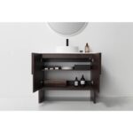 The Celle 36 Inch Bathroom Vanity With Vessel Sink features open dark wood cabinets with shelves for towels and toiletries, plus a round mirror and a white vessel sink with black faucet for a modern touch.