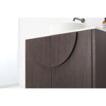 The Celle 36 Inch Bathroom Vanity With Vessel Sink boasts dark wood cabinets, a curved handle design, a sleek white countertop and vessel sink, plus a minimalist wall-mounted faucet.